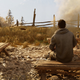 basim sitting at the fire in assassins creed valhalla